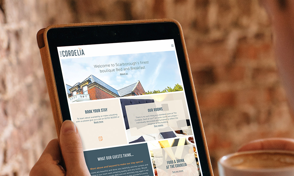 The Cordelia website homepage shown on an iPad